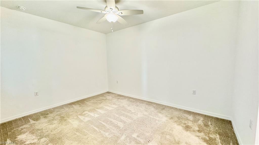 43993 Boardwalk Loop, Unit 1932 Punta Gorda, FL 33982 - Photo 10 of 17 an empty room with a window and a ceiling fan