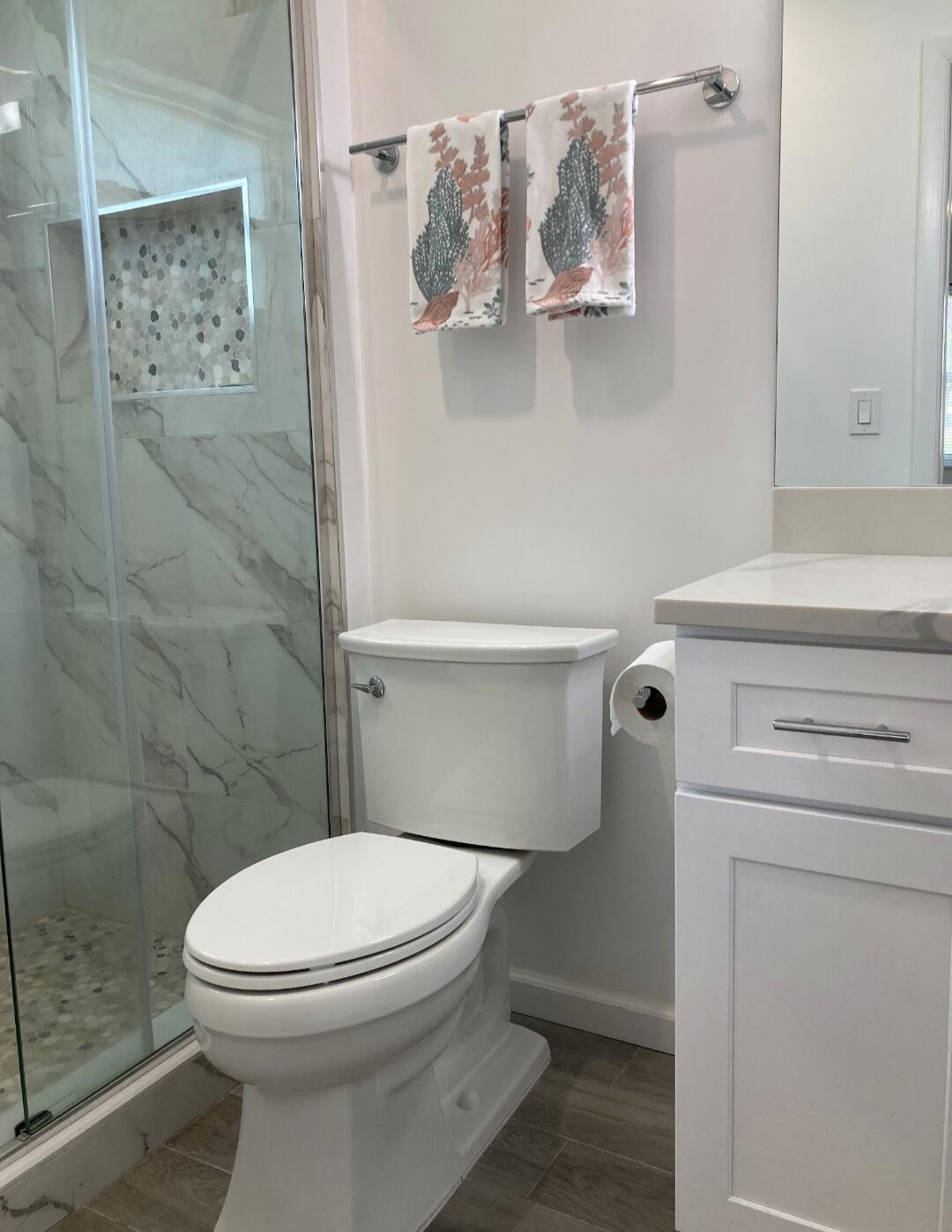 1155 South Drive Circle, Unit A Delray Beach, FL 33445 - Photo 17 of 21 a bathroom with a toilet and a shower
