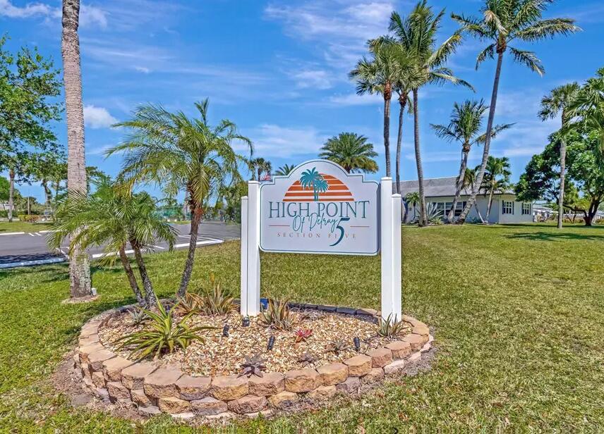 1155 South Drive Circle, Unit A Delray Beach, FL 33445 - Photo 20 of 21 a view of a sign board with yard