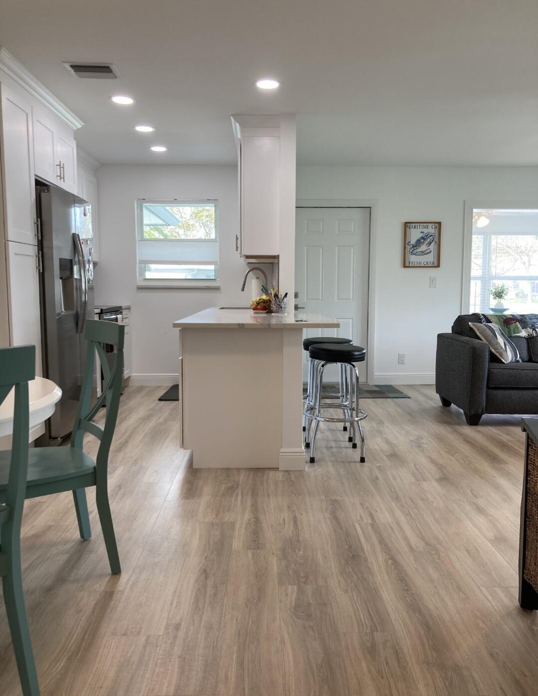 1155 South Drive Circle, Unit A Delray Beach, FL 33445 - Photo 6 of 21 a living room with furniture and a wooden floor