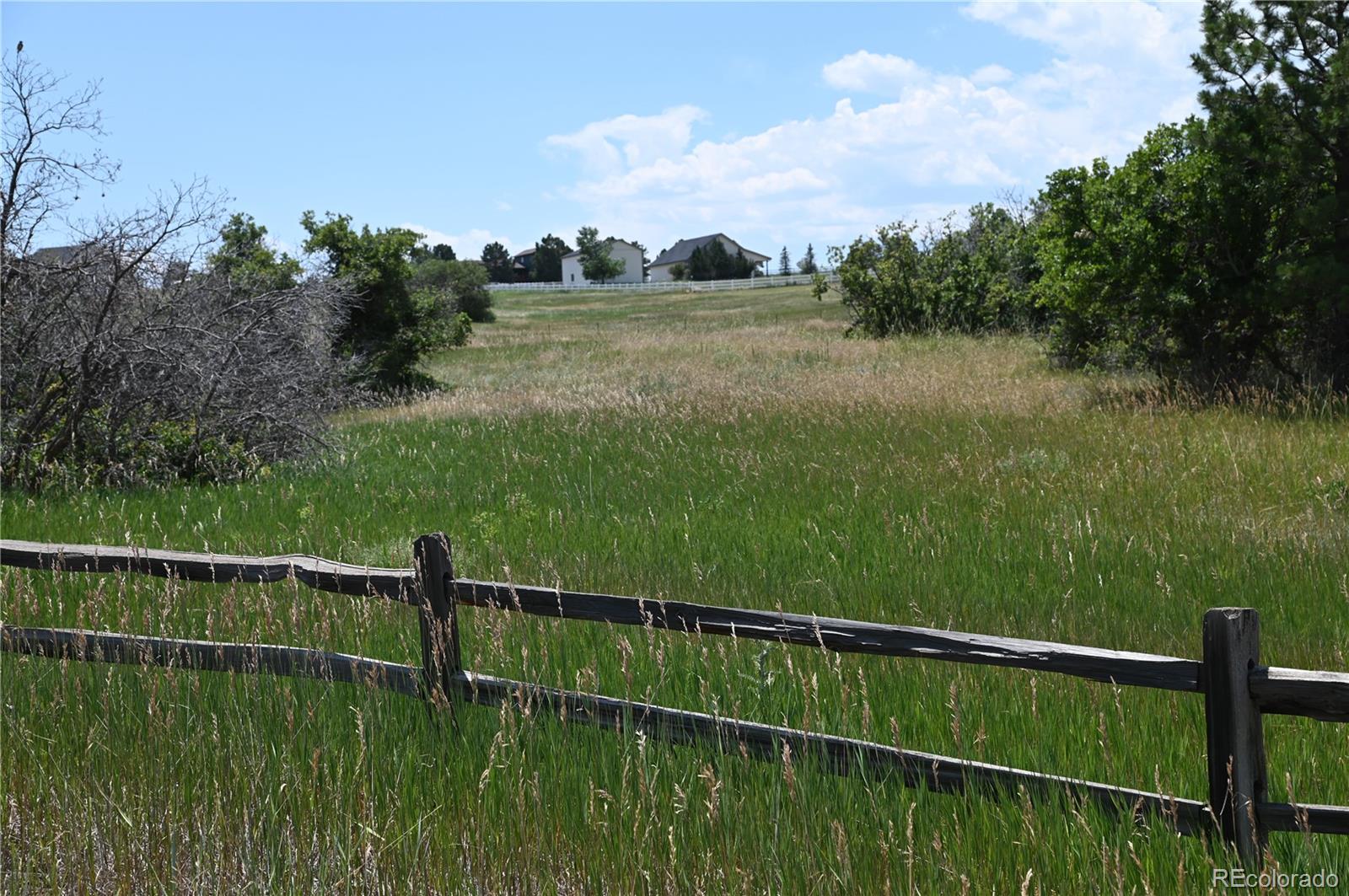 1579 Deerpath Road Franktown, CO 80116 - Photo 11 of 49 a view of a balcony with lake view