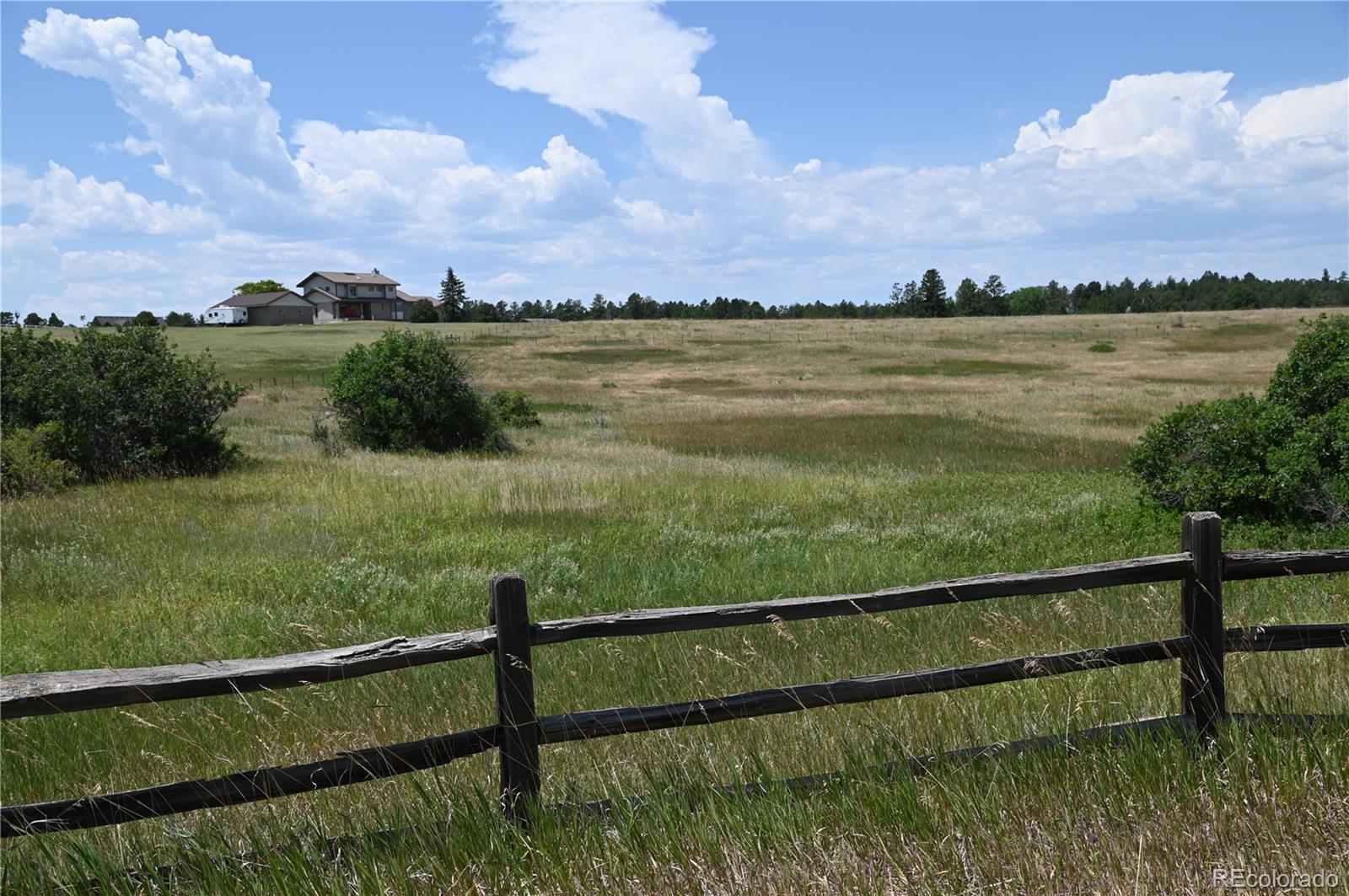 1579 Deerpath Road Franktown, CO 80116 - Photo 2 of 49 a view of lake from balcony
