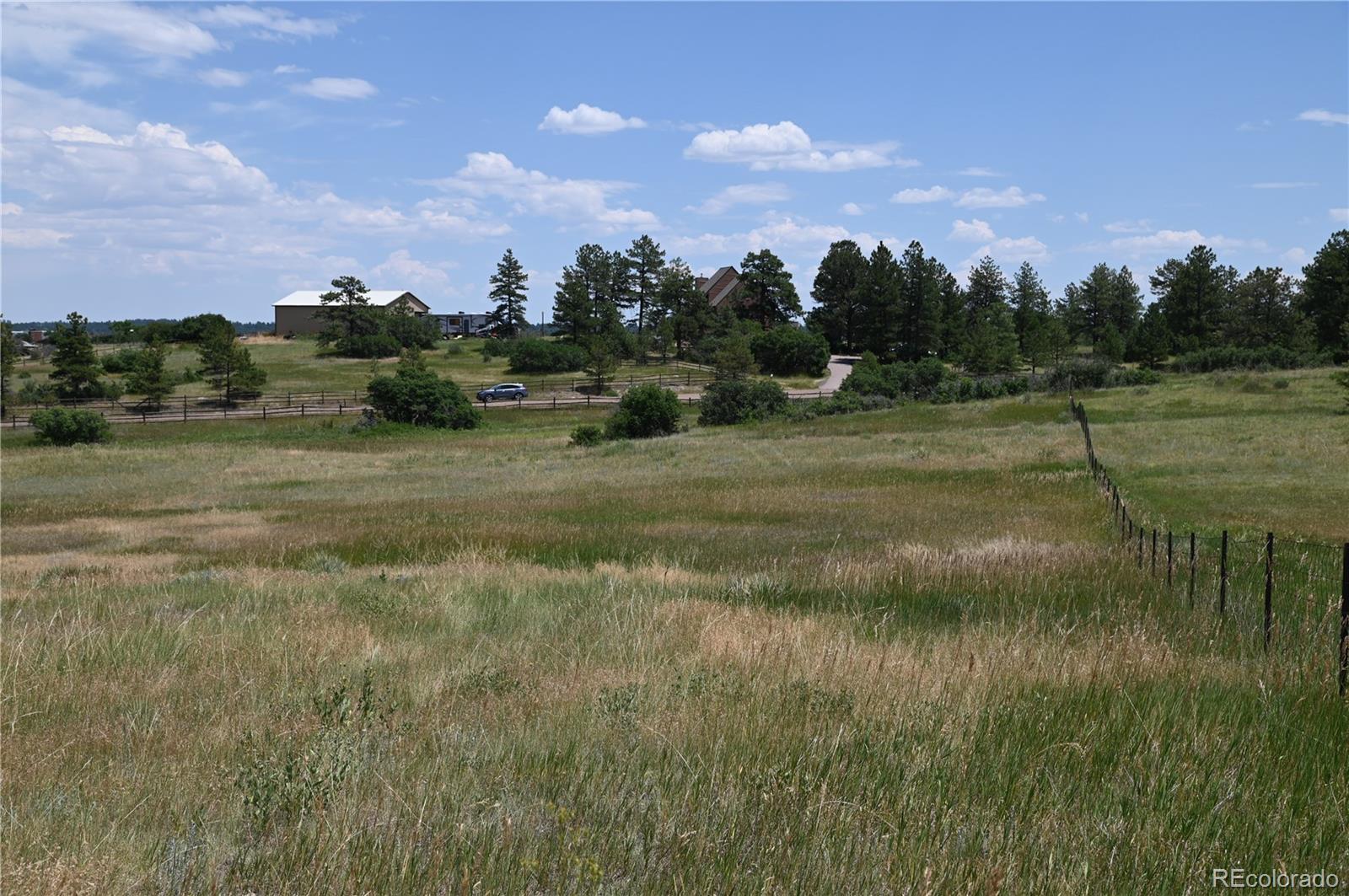 1579 Deerpath Road Franktown, CO 80116 - Photo 23 of 49 a view of a lake view