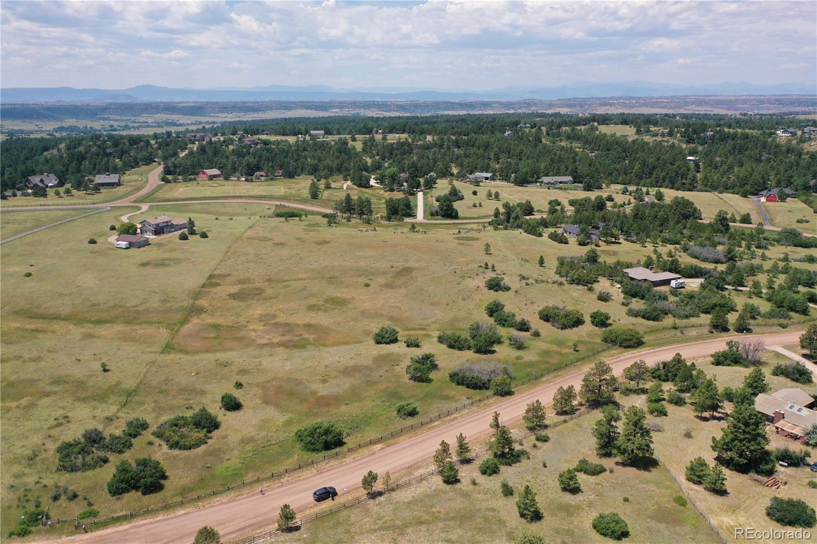 1579 Deerpath Road Franktown, CO 80116 - Photo 41 of 49 a view of a city with an outdoor space