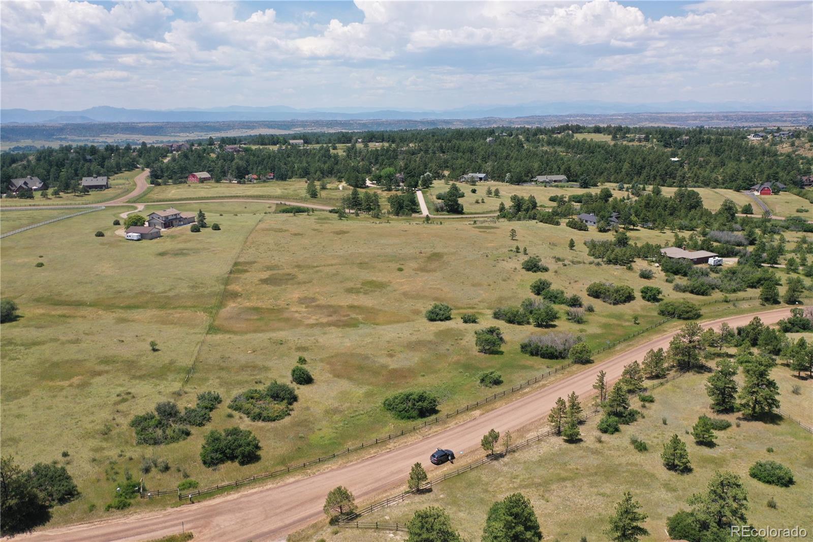 1579 Deerpath Road Franktown, CO 80116 - Photo 46 of 49 a view of a city with an ocean view