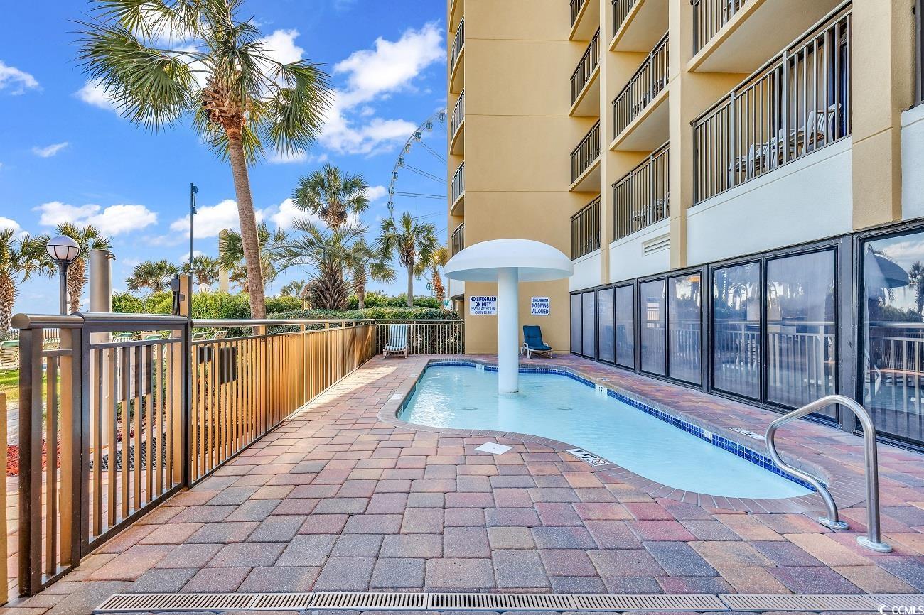 1202 North Ocean Boulevard, Unit 310 Myrtle Beach, SC 29577 - Photo 16 of 29 Community pool with a patio area
