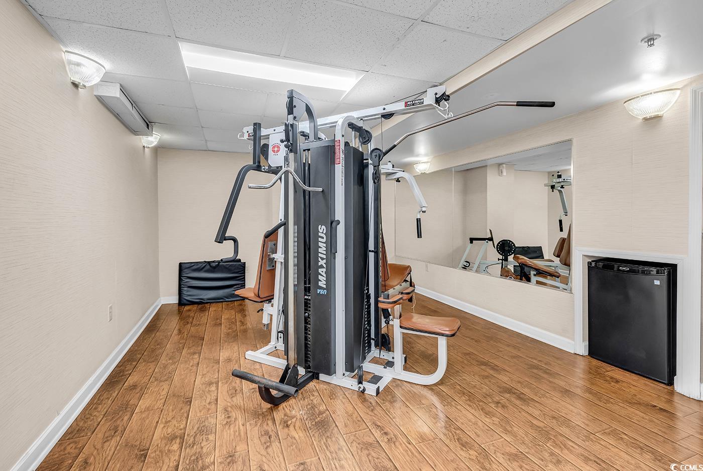 1202 North Ocean Boulevard, Unit 310 Myrtle Beach, SC 29577 - Photo 18 of 29 Workout area featuring a drop ceiling