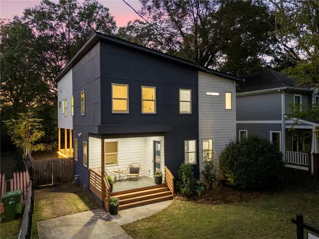 a backyard of a house with seating space