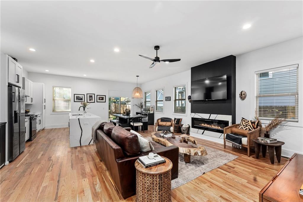 210 Locust Street Northeast Atlanta, GA 30317 - Photo 20 of 54 a living room with furniture a flat screen tv and wooden floor