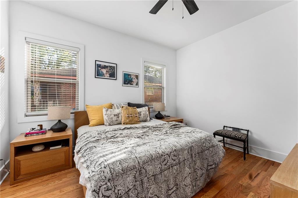 210 Locust Street Northeast Atlanta, GA 30317 - Photo 24 of 54 a bedroom with a bed and wooden floor