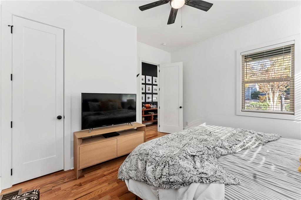 210 Locust Street Northeast Atlanta, GA 30317 - Photo 25 of 54 a bedroom with a bed and a flat screen tv