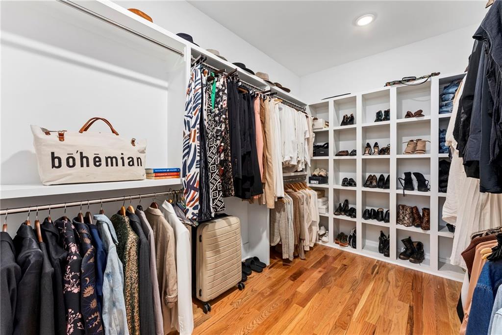 210 Locust Street Northeast Atlanta, GA 30317 - Photo 32 of 54 a view of walk in closet with clothes and shoes