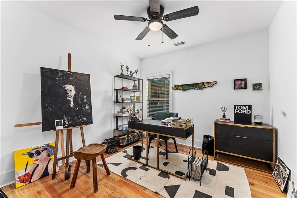 210 Locust Street Northeast Atlanta, GA 30317 - Photo 35 of 54 a view of a workspace with furniture and wooden floor