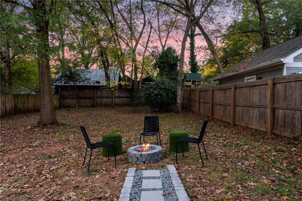 210 Locust Street Northeast Atlanta, GA 30317 - Photo 39 of 54 a view of a chairs and table in backyard