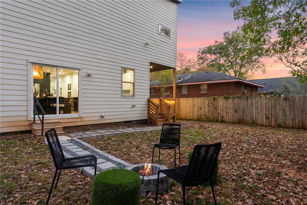 210 Locust Street Northeast Atlanta, GA 30317 - Photo 40 of 54 a backyard of a house with table and chairs