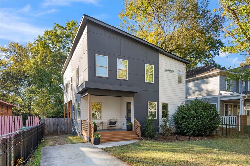 210 Locust Street Northeast Atlanta, GA 30317 - Photo 5 of 54 front view of a house with a yard