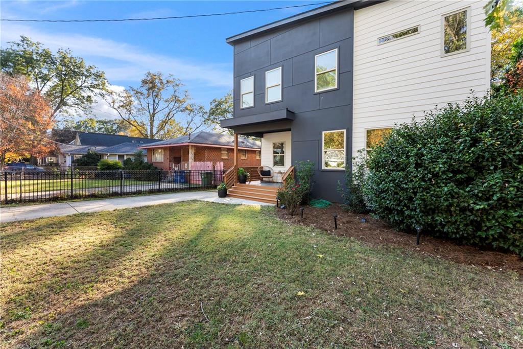 210 Locust Street Northeast Atlanta, GA 30317 - Photo 6 of 54 a view of a house with a yard