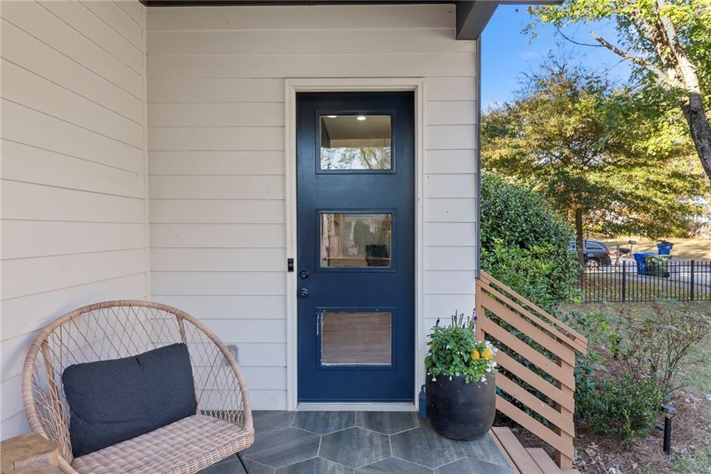 210 Locust Street Northeast Atlanta, GA 30317 - Photo 9 of 54 a view of a door of the house with a bench