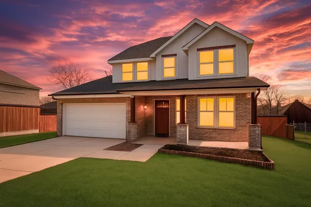 front view of a house with a yard