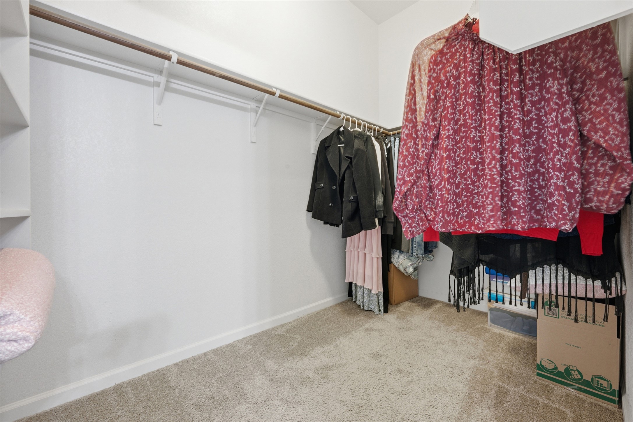 276 Gunnison Way Kyle, TX 78640 - Photo 14 of 28 a view of walk in closet with clothes