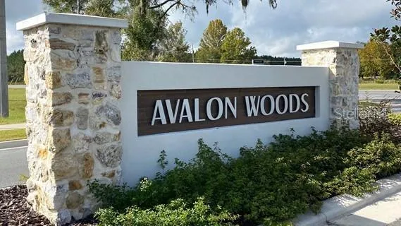 a sign broad in front of the house