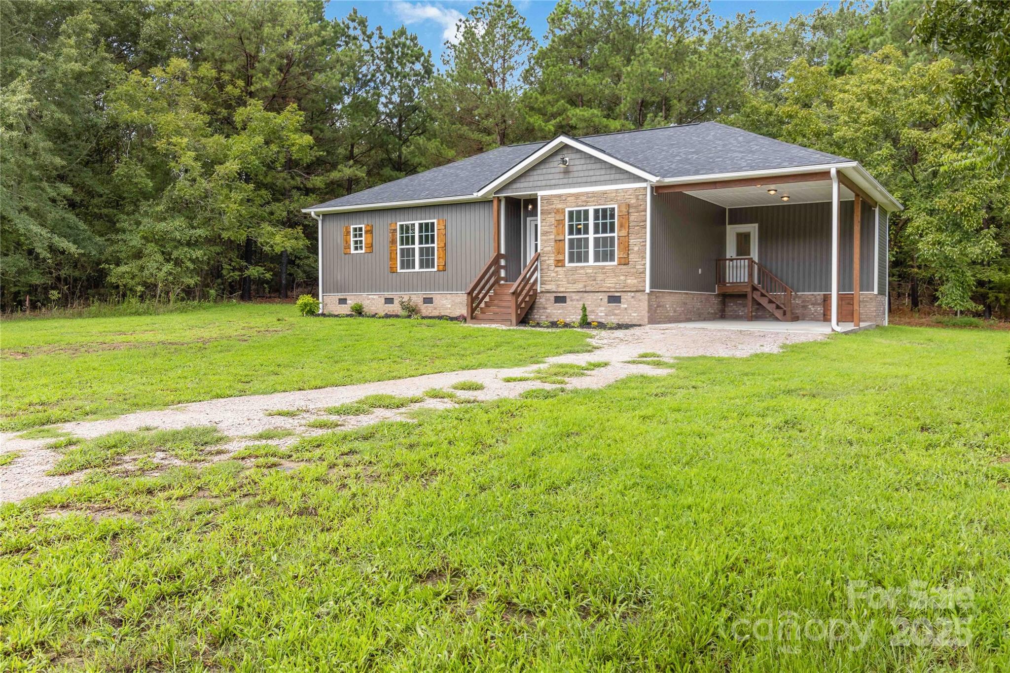 2434 Wo Gladden Road Chester, SC 29706 - Photo 24 of 30 a front view of a house with a yard and porch