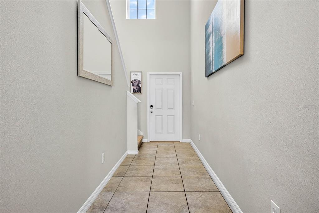 9616 Lemon Drop Loop Sun City Center, FL 33573 - Photo 8 of 53 a view of a hallway with white walls