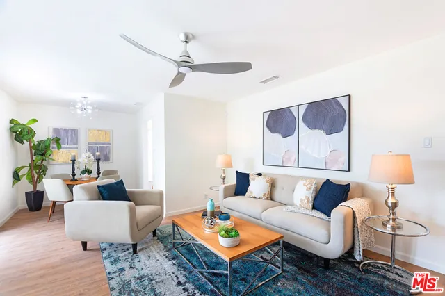 a living room with furniture and a rug