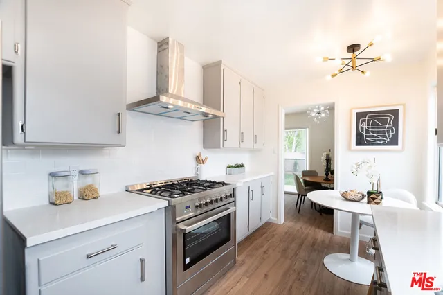 a living room with furniture a window and a table