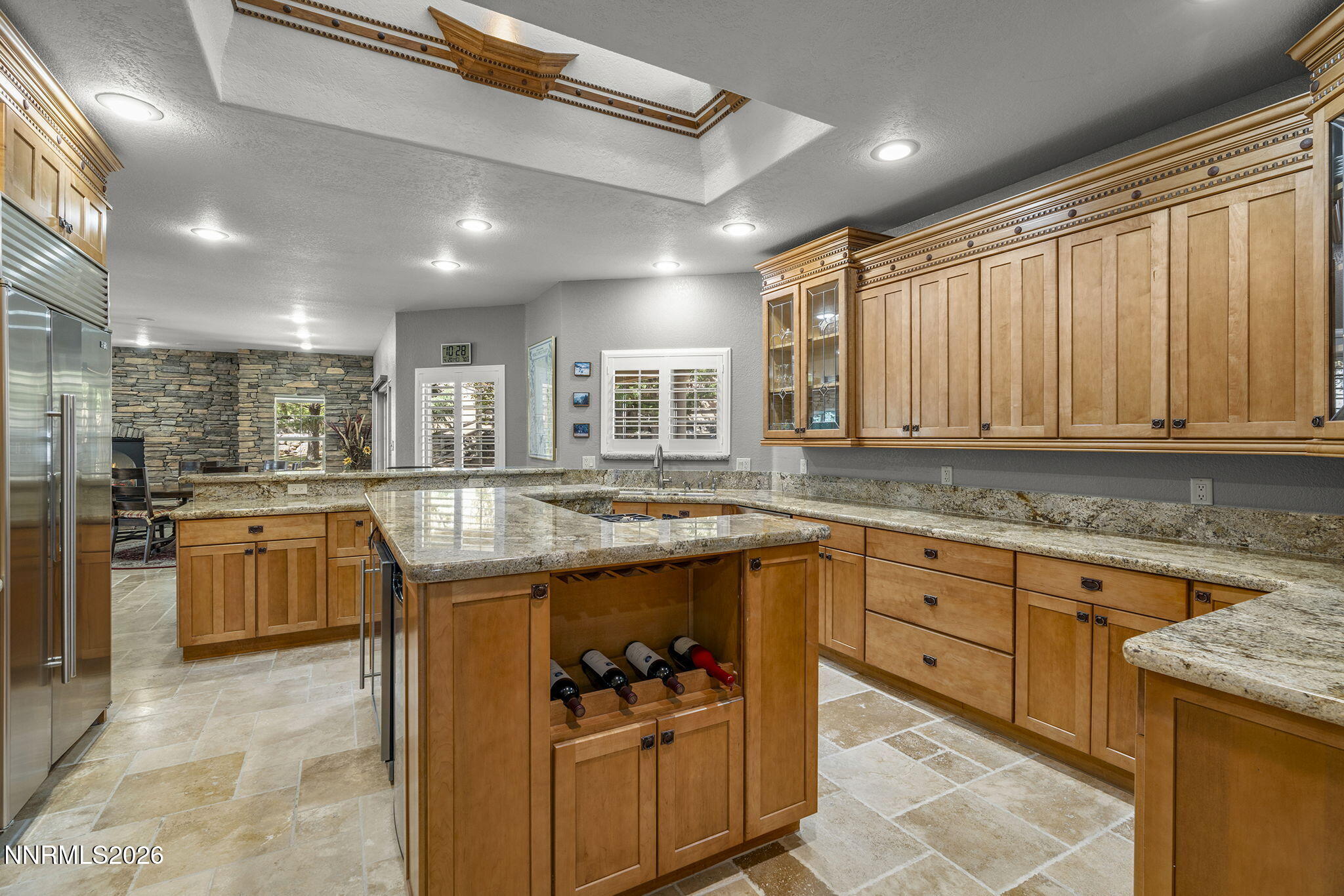 14501 Quail Rock Court Reno, NV 89511 - Photo 11 of 42 a kitchen with stainless steel appliances granite countertop sink stove and refrigerator