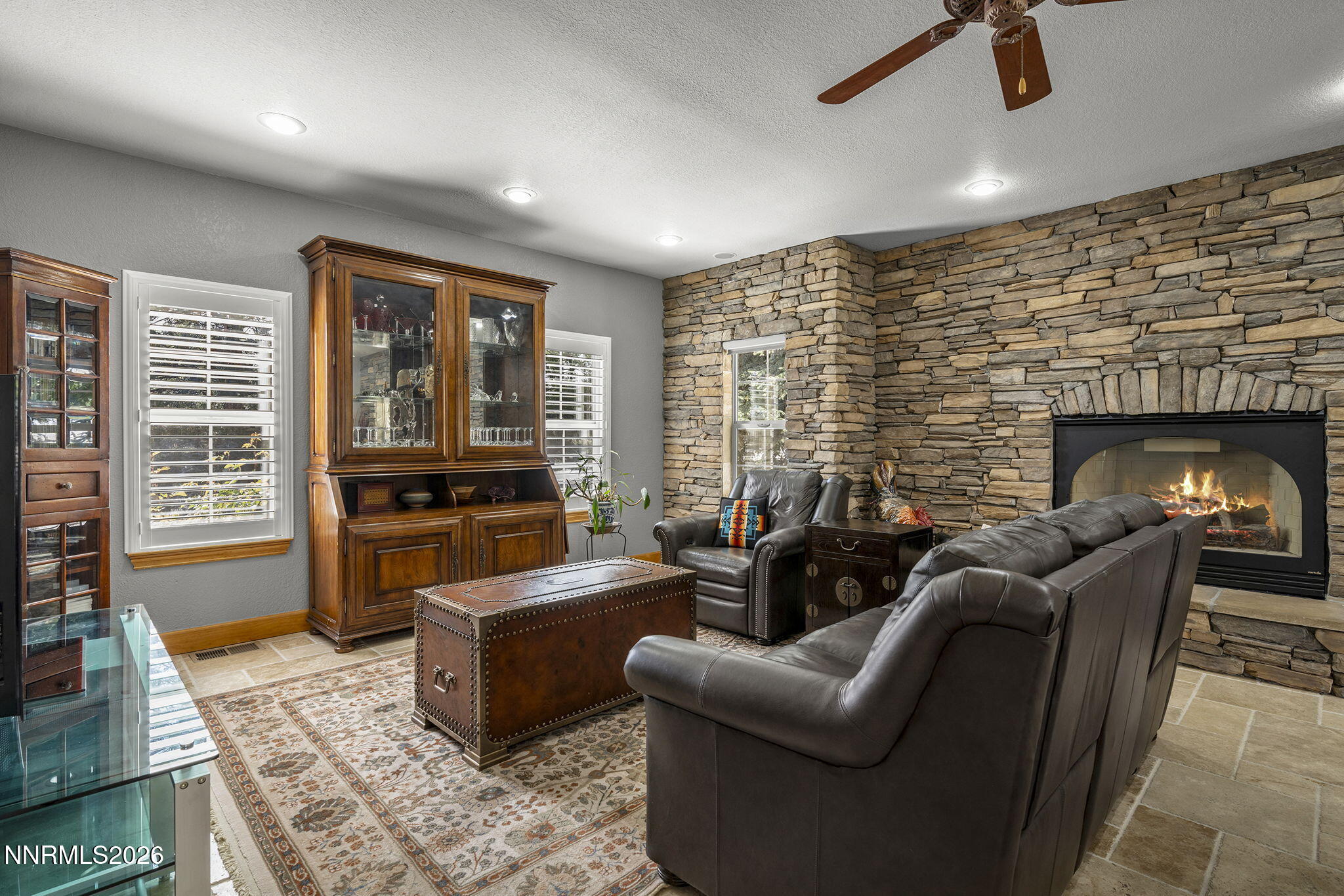 14501 Quail Rock Court Reno, NV 89511 - Photo 18 of 42 a living room with furniture and a fireplace
