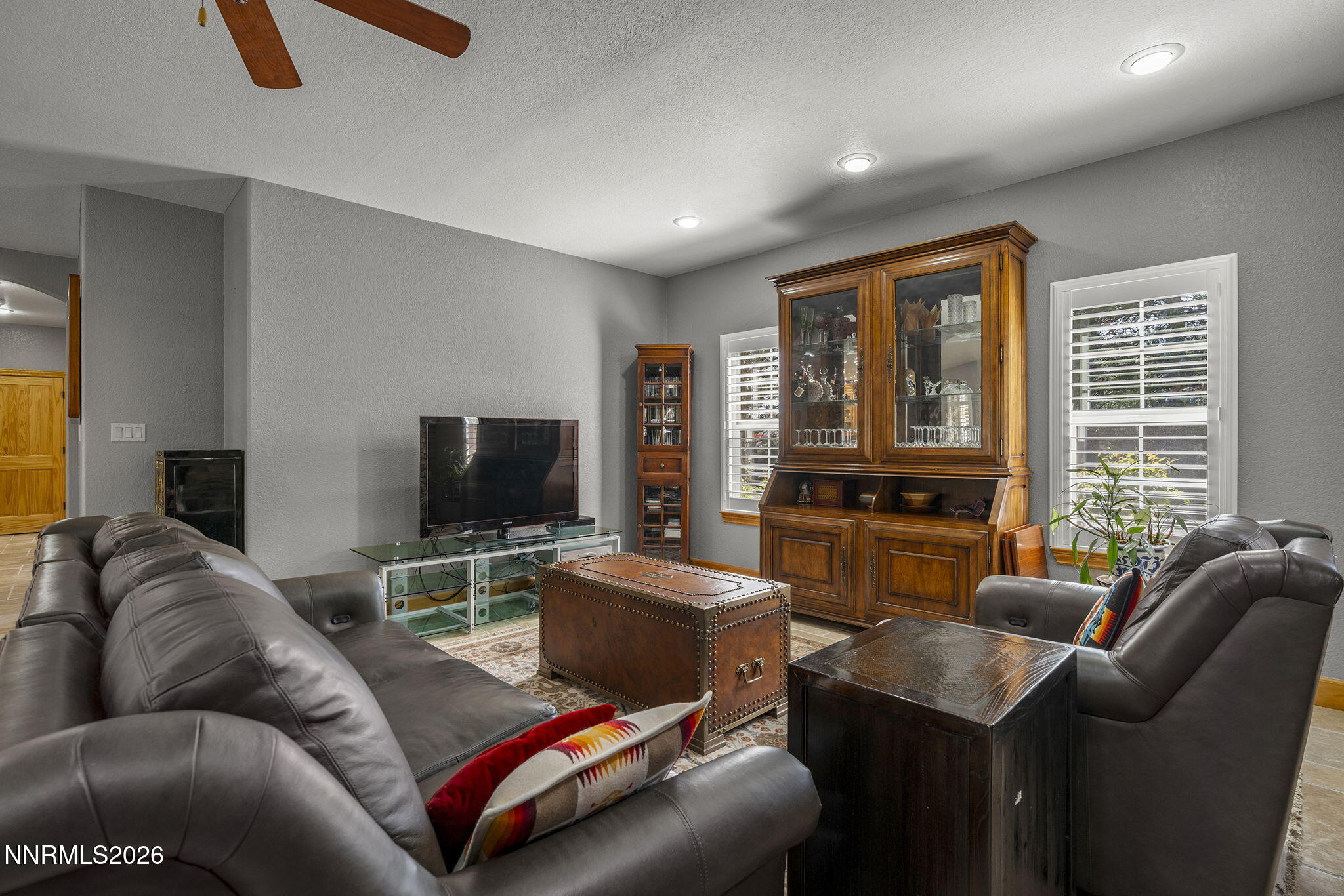 14501 Quail Rock Court Reno, NV 89511 - Photo 19 of 42 a living room with furniture and a flat screen tv