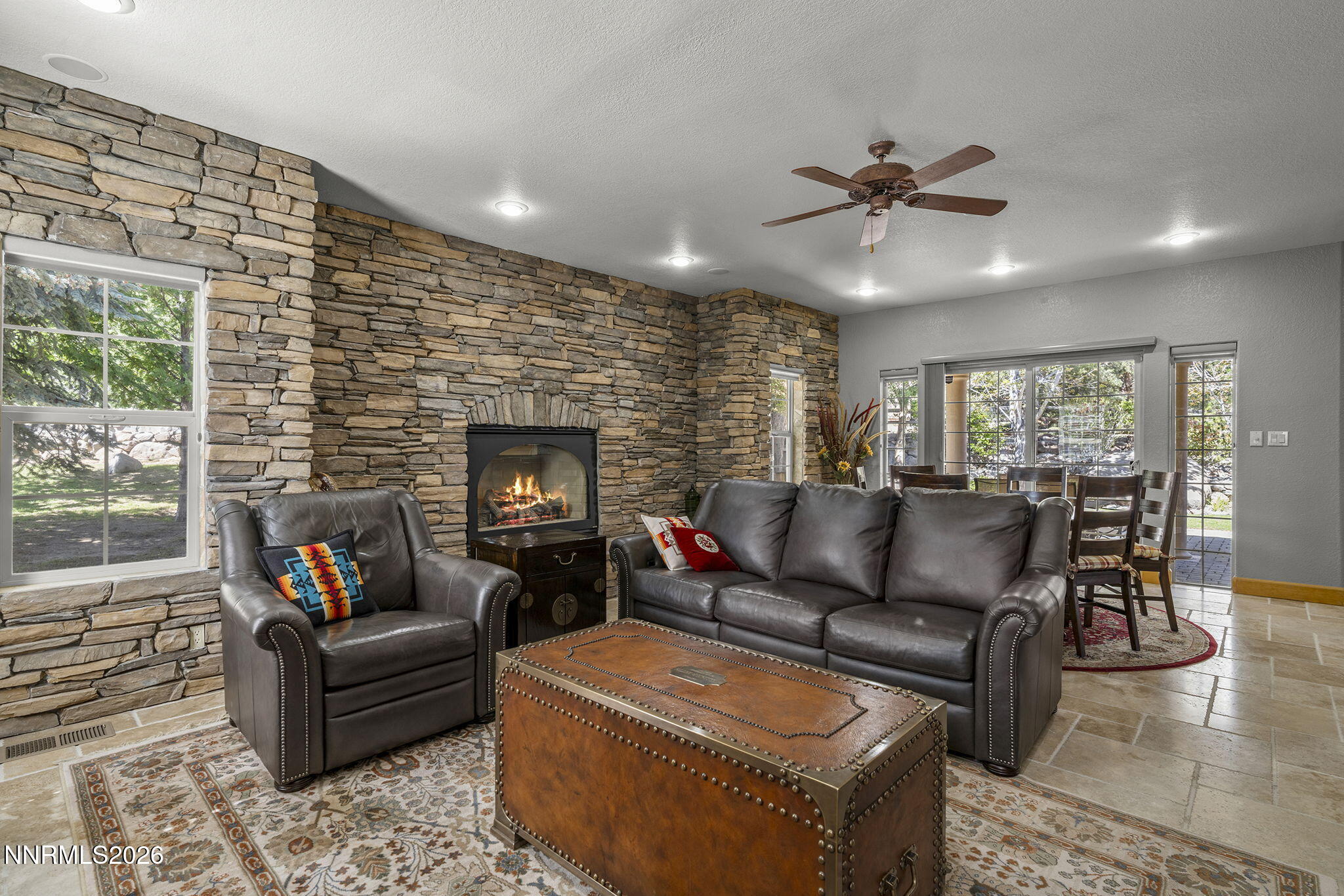 14501 Quail Rock Court Reno, NV 89511 - Photo 20 of 42 a living room with furniture and a fireplace