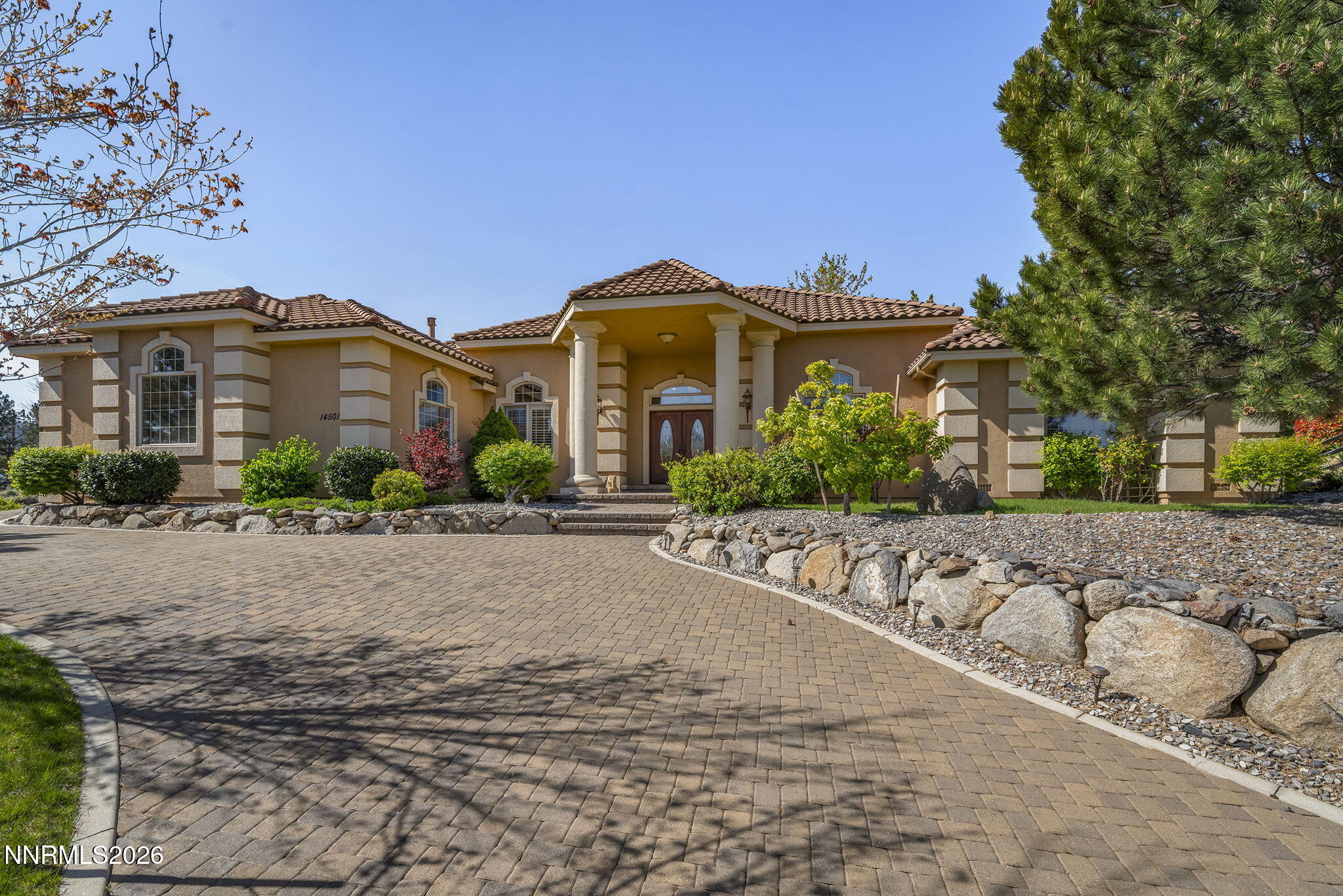 14501 Quail Rock Court Reno, NV 89511 - Photo 2 of 42 a front view of a house with a yard