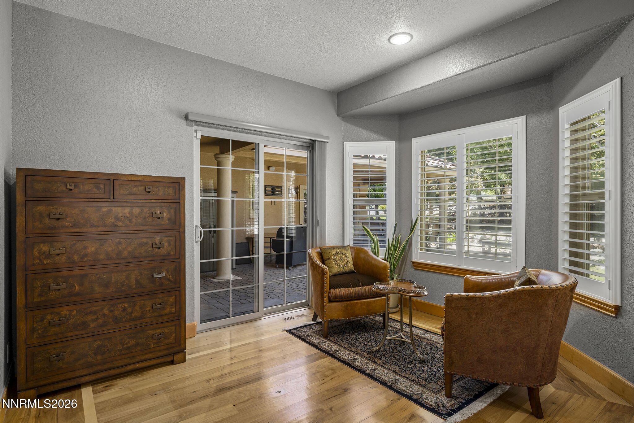 14501 Quail Rock Court Reno, NV 89511 - Photo 23 of 42 a living room with furniture and a floor to ceiling window