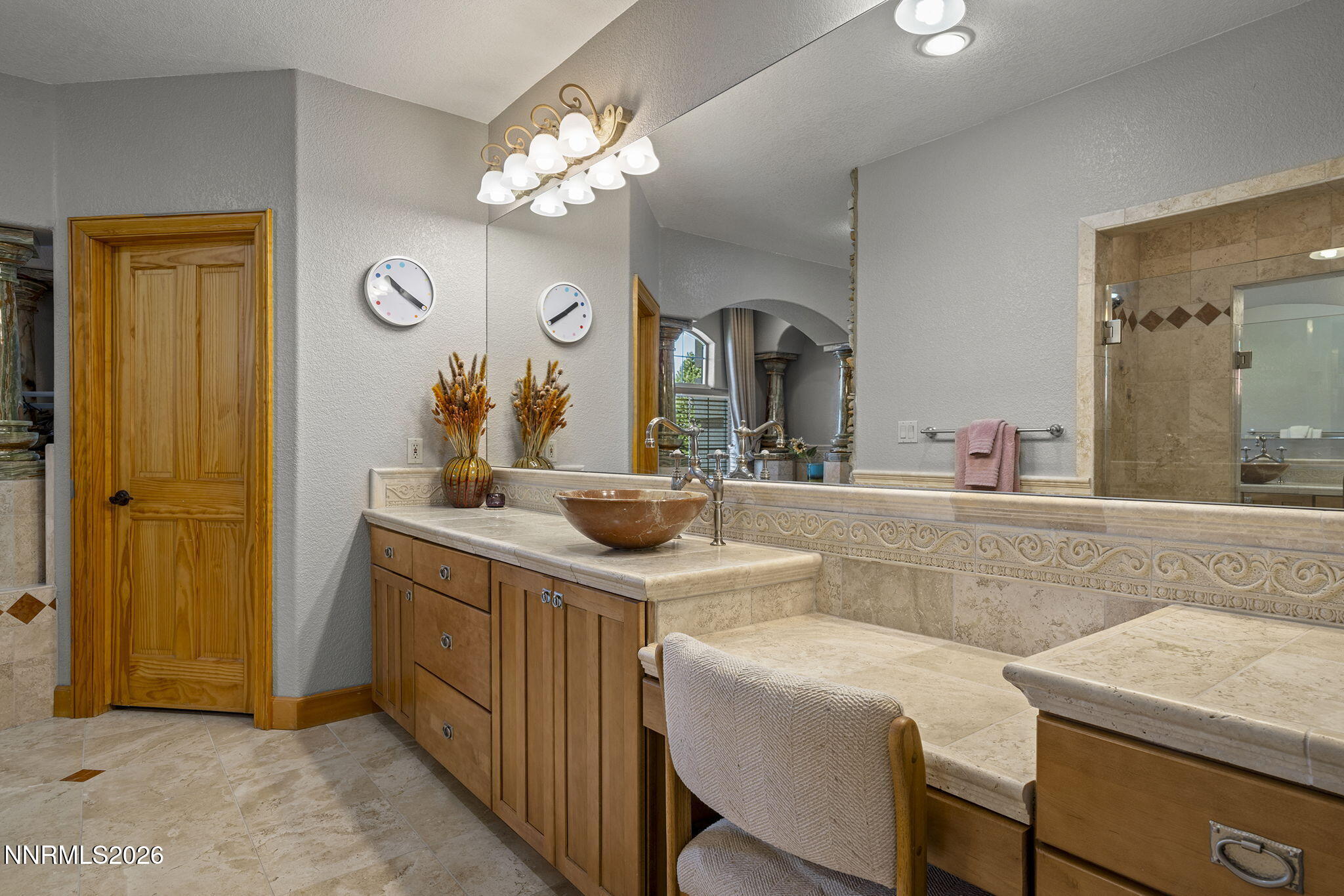 14501 Quail Rock Court Reno, NV 89511 - Photo 25 of 42 a bathroom with a sink and a mirror