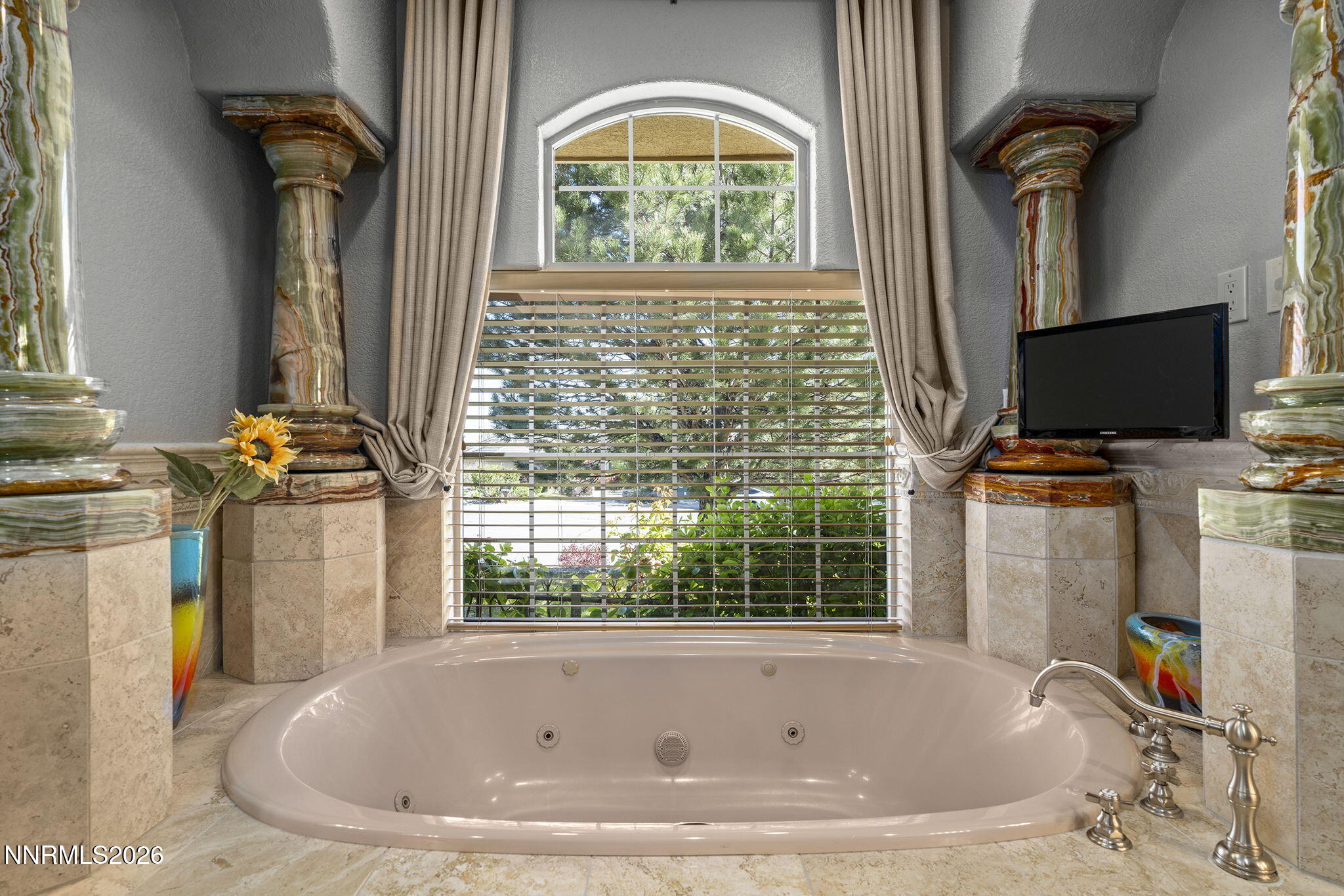 14501 Quail Rock Court Reno, NV 89511 - Photo 26 of 42 a bathroom with a tub and a window