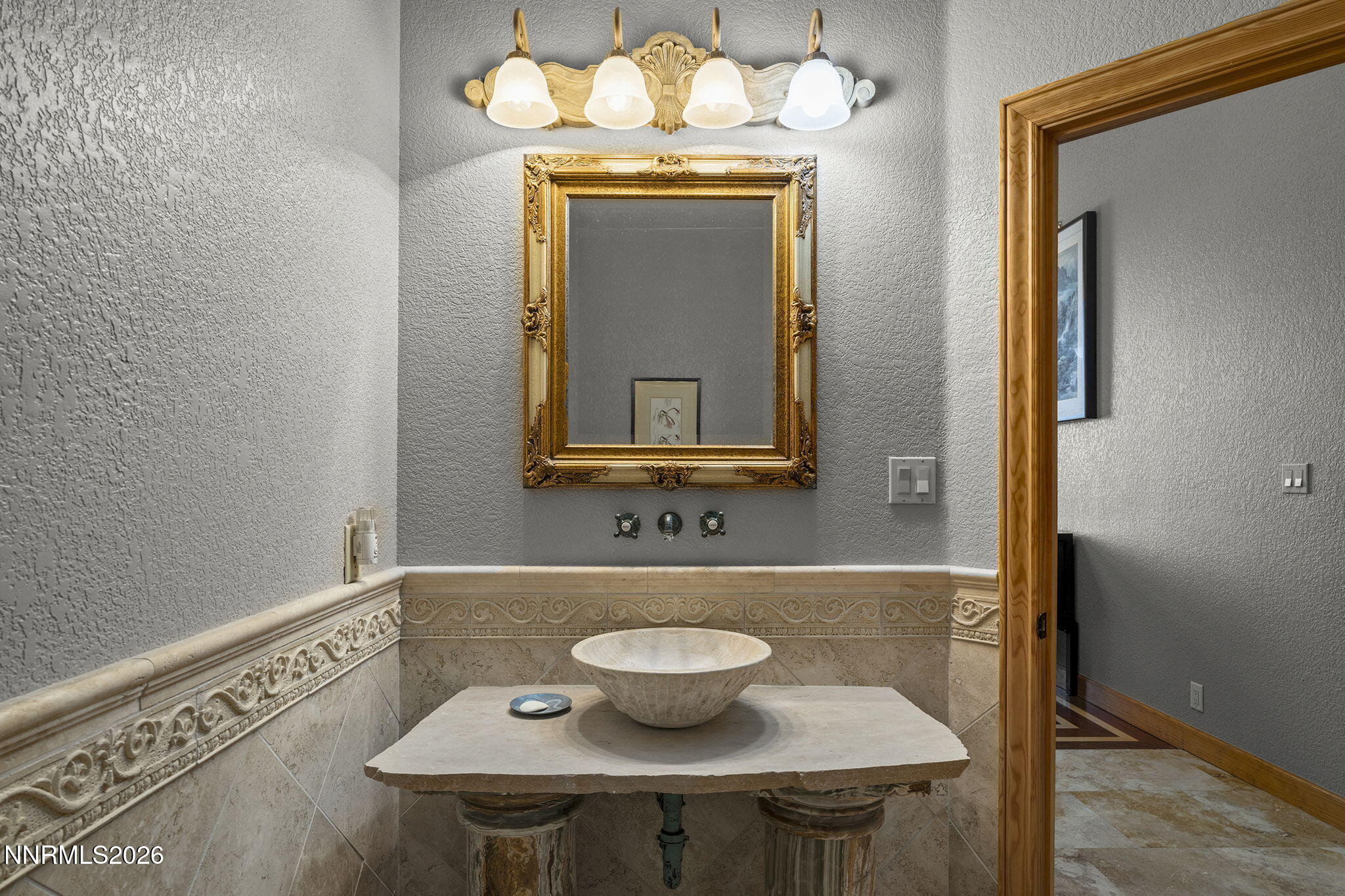 14501 Quail Rock Court Reno, NV 89511 - Photo 28 of 42 a bathroom with a sink and a mirror