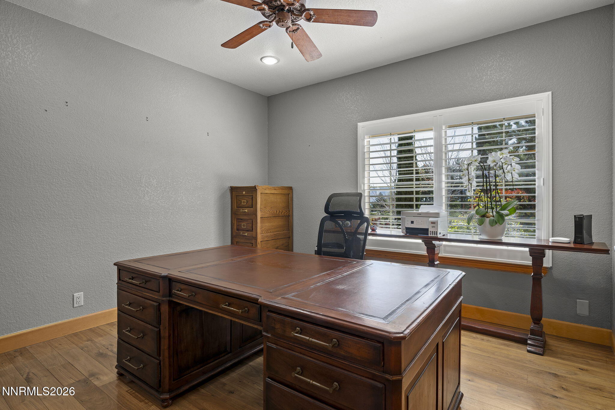 14501 Quail Rock Court Reno, NV 89511 - Photo 31 of 42 a view of a dining room with furniture window and wooden floor