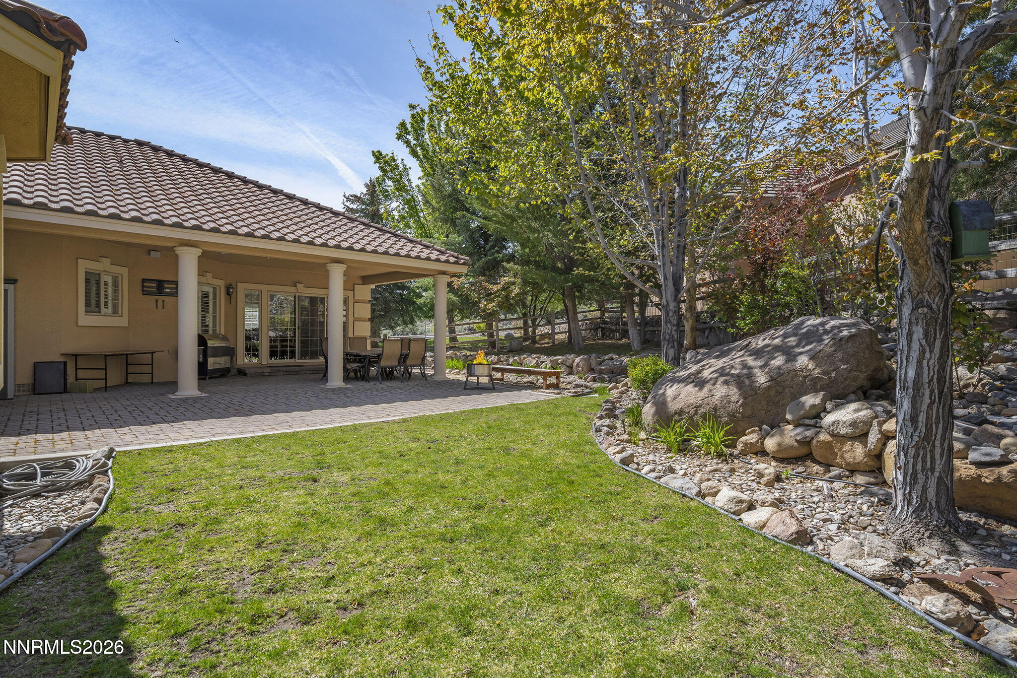 14501 Quail Rock Court Reno, NV 89511 - Photo 41 of 42 a view of a house with backyard porch and patio