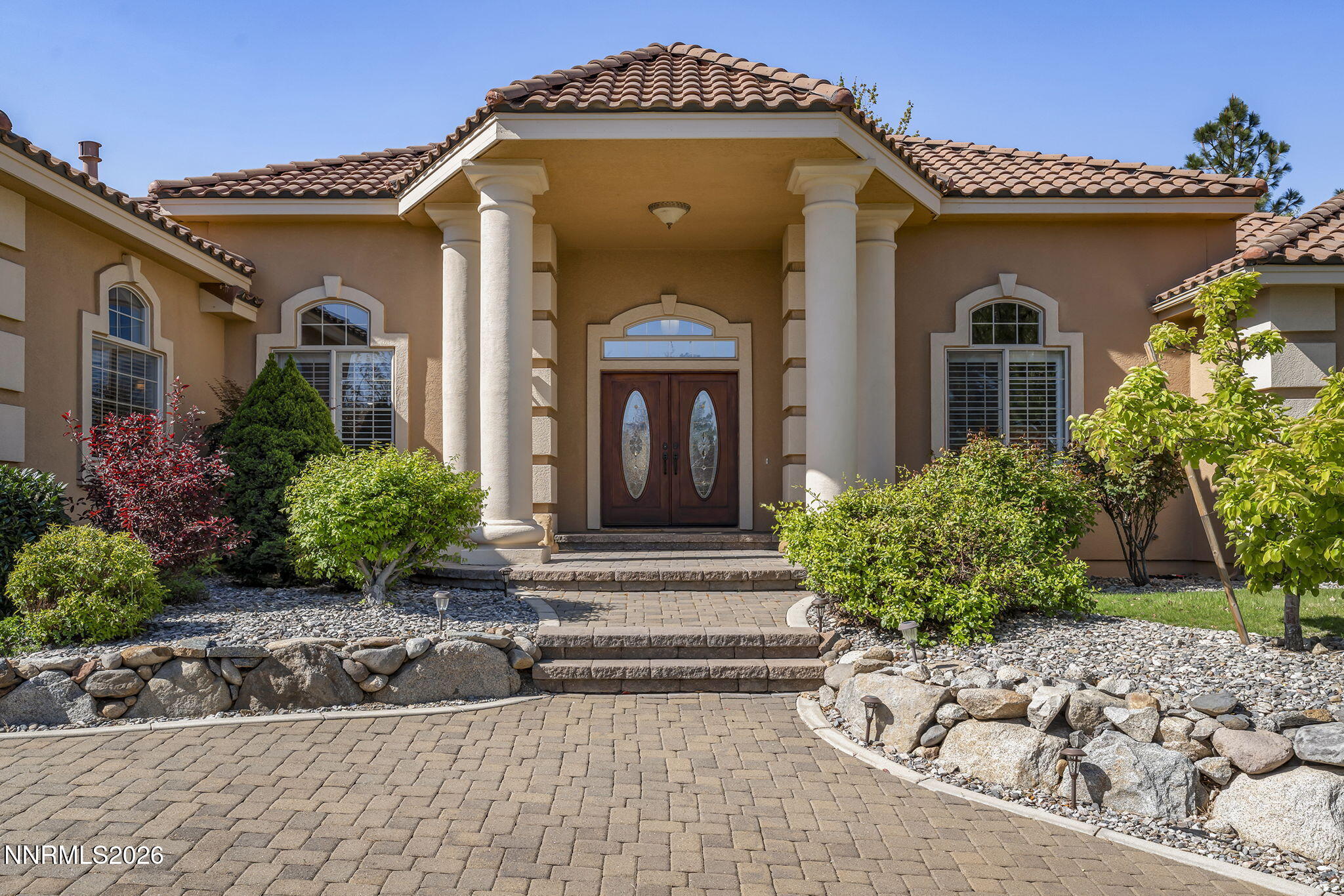 14501 Quail Rock Court Reno, NV 89511 - Photo 5 of 42 a front view of a house with garden