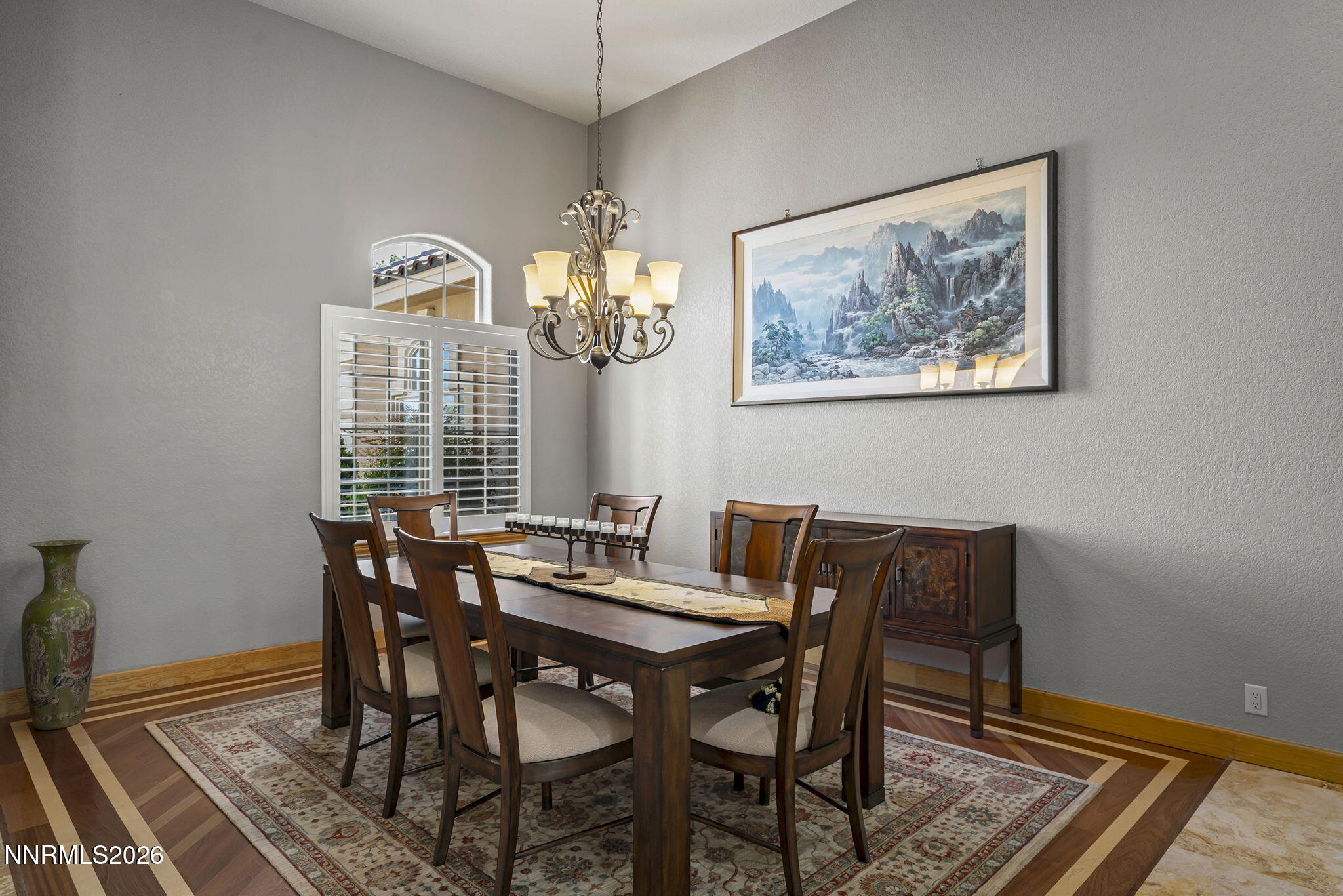 14501 Quail Rock Court Reno, NV 89511 - Photo 9 of 42 a view of a dining room with furniture wooden floor and a chandelier
