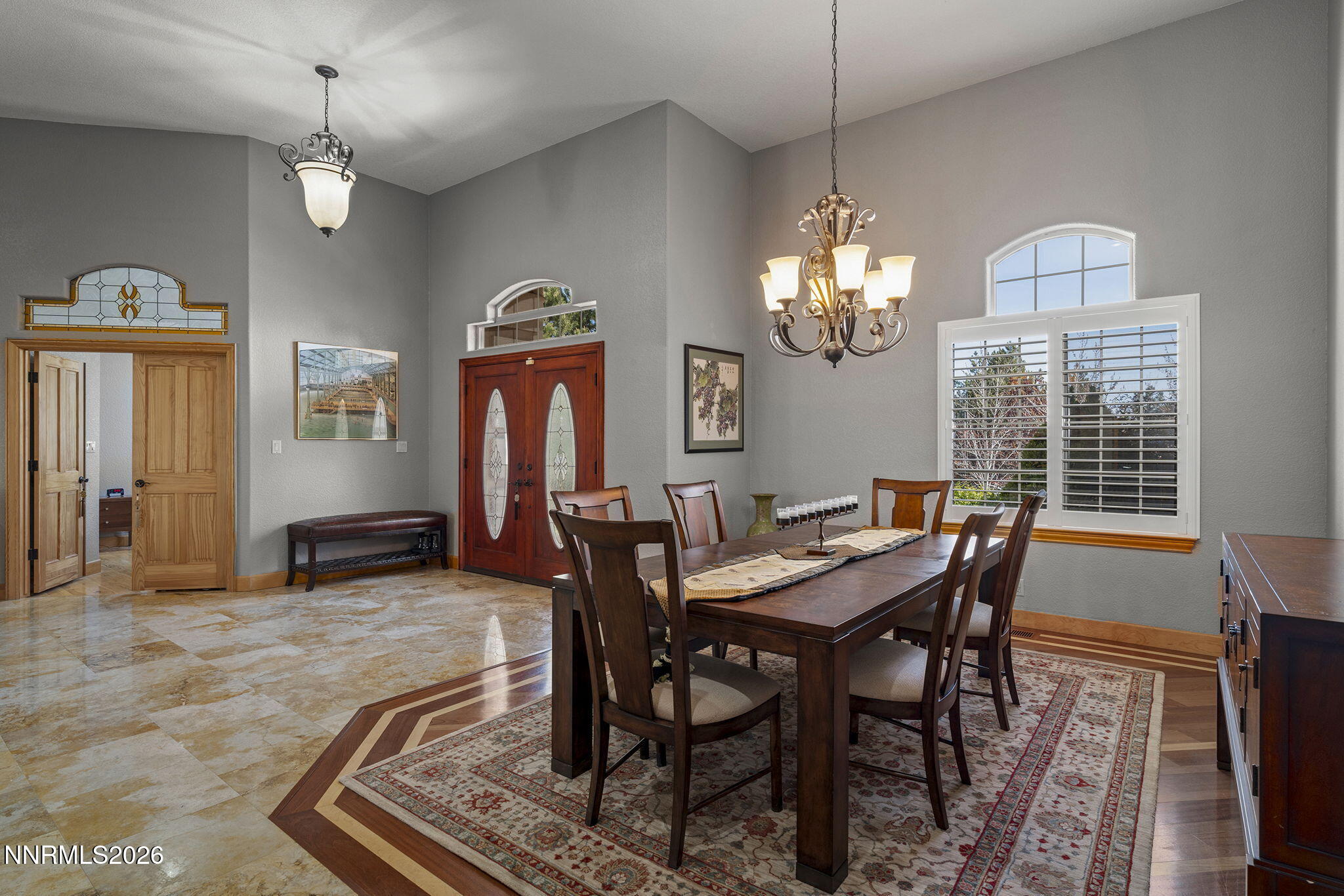 14501 Quail Rock Court Reno, NV 89511 - Photo 10 of 42 a view of a dining room with furniture window and wooden floor