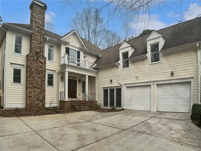 a front view of a house with a garage