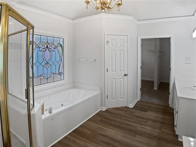 a bathroom with a bathtub and a shower
