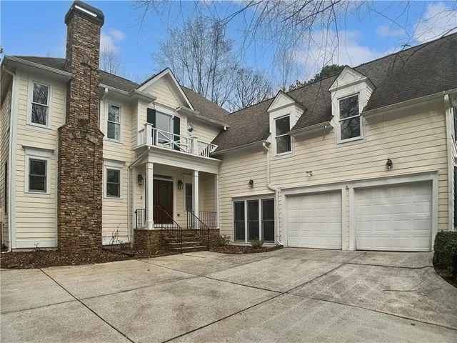 a front view of a house with a garage