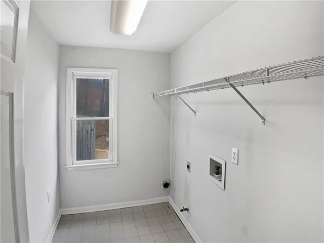 a bathroom with a window and a shower