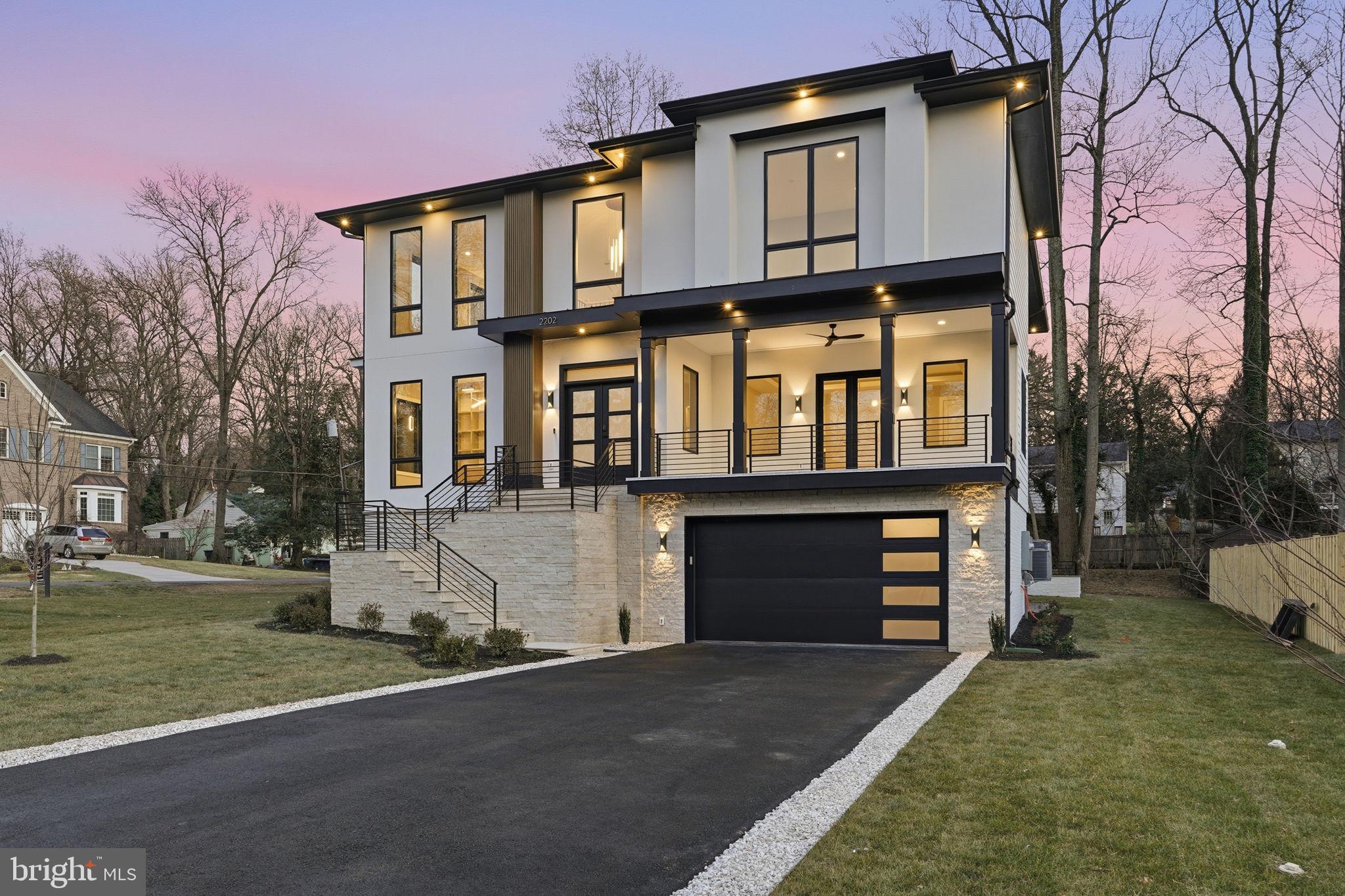 2202 Grayson Place Falls Church, VA 22043 - Photo 1 of 77 a front view of a house with a yard and garage