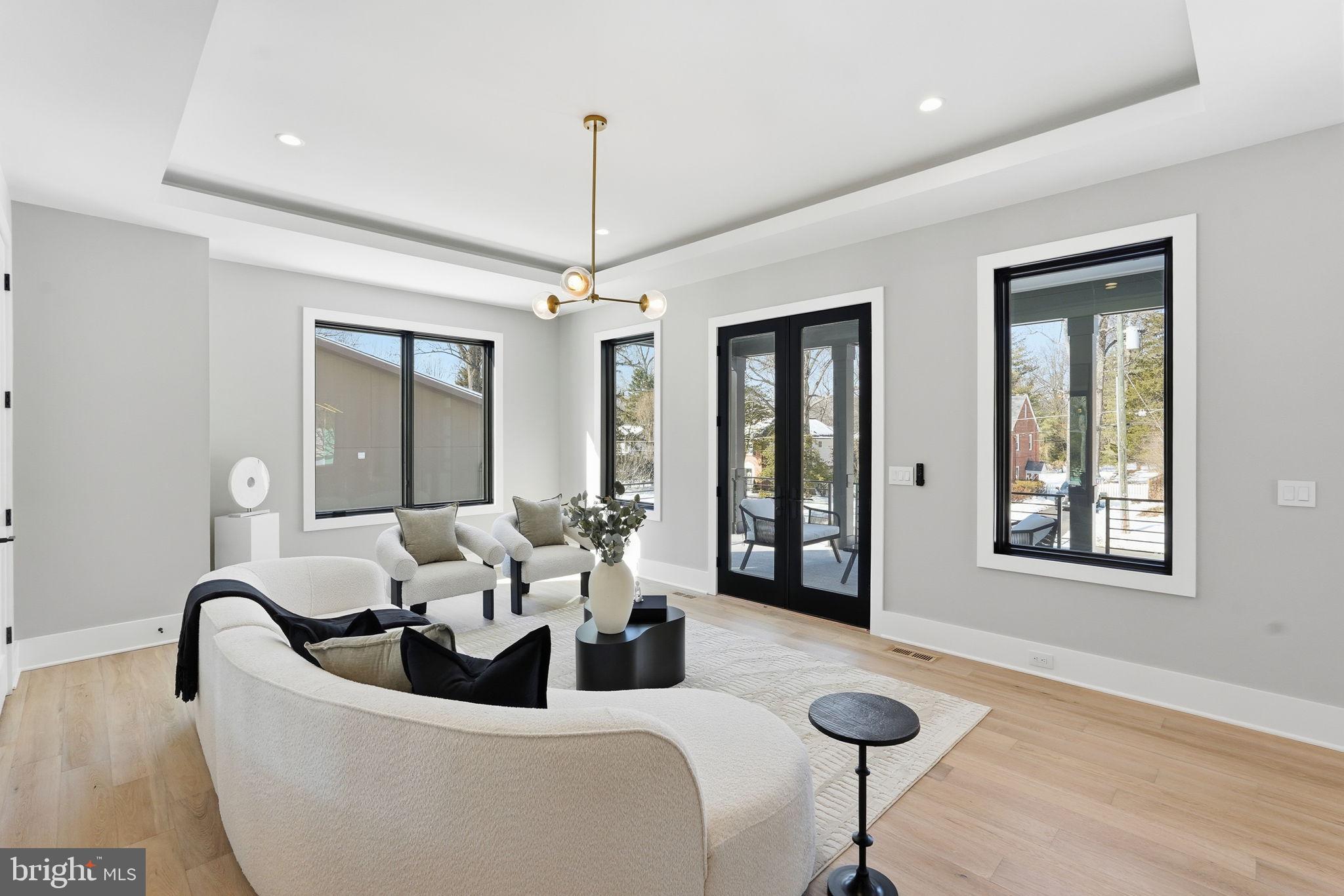 2202 Grayson Place Falls Church, VA 22043 - Photo 27 of 77 a living room with furniture a chandelier and a window