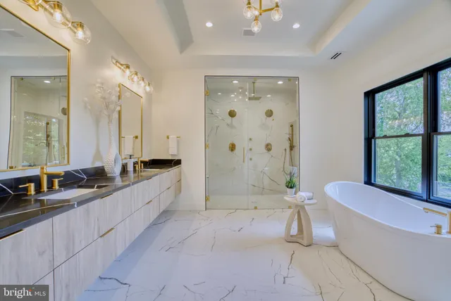 a large bathroom with a double vanity sink a large mirror and shower